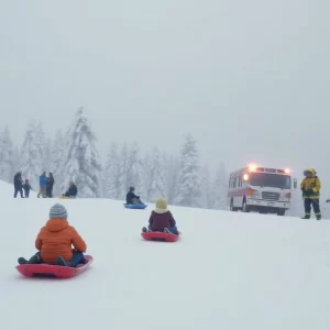Emergency responders rescuing a child during a winter storm in Atlanta