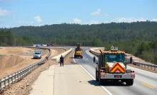 Construction work on Georgia highways with workers and machinery.
