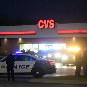 Police vehicles and emergency personnel at CVS after shooting incident