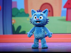 Scene from Pete the Cat stage production with colorful puppets