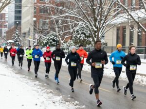 Runners participating in Polar Opposite Peachtree Race in winter.