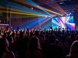 Audience enjoying the Riot Ten House Party concert at Believe Music Hall