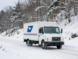 USPS delivery truck navigating snowy roads in Georgia winter