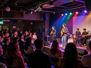 Audience enjoying a live music concert at a small venue in Atlanta